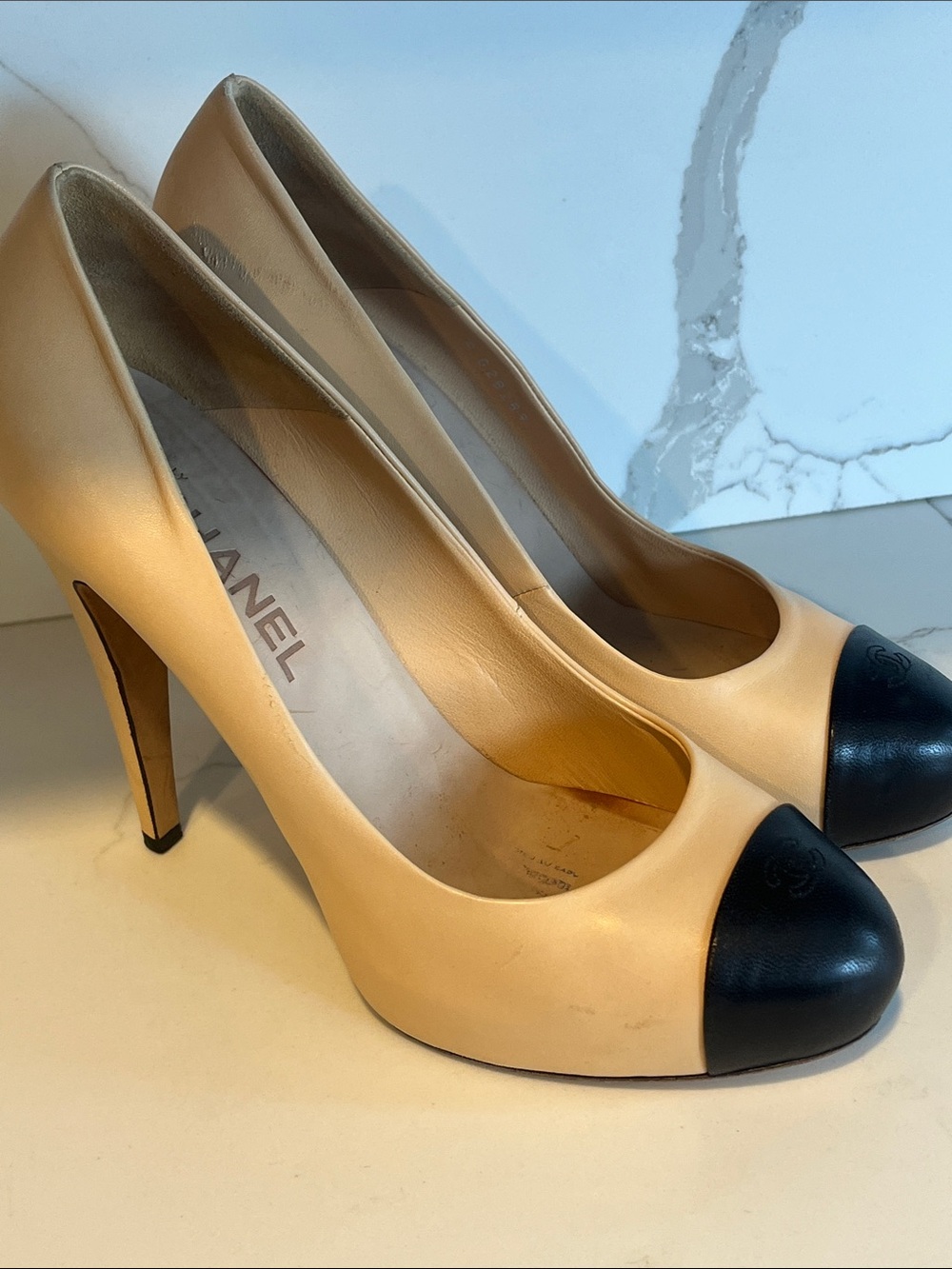 CHANEL Beige Leather Pumps with Black Cap Toes